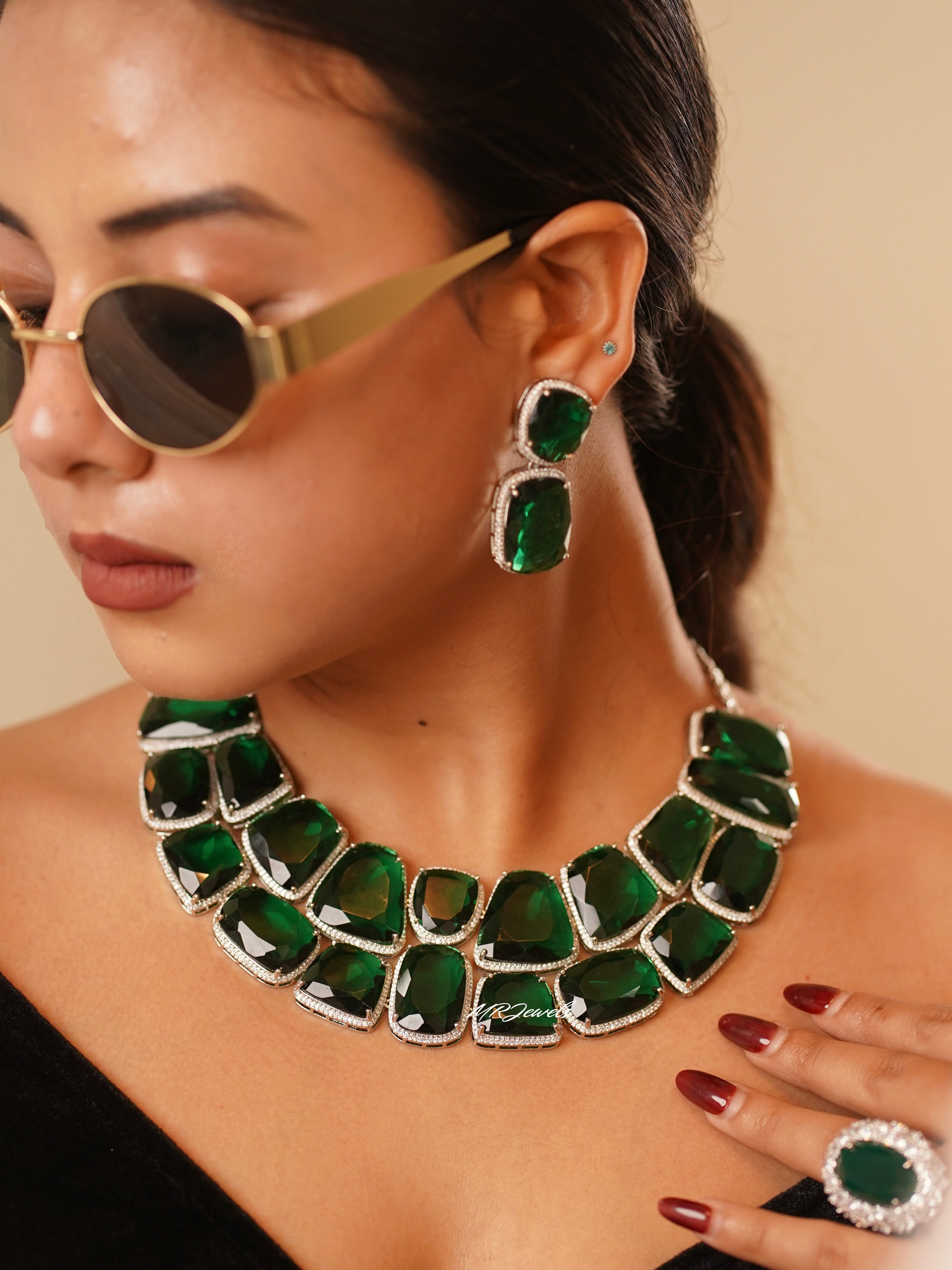 Emerald luxe set with oversized green stones in choker, earrings, and cocktail ring ensemble